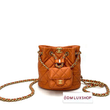 Load image into Gallery viewer, Chanel 23A Orange Bucket Backpack
