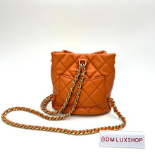 Load image into Gallery viewer, Chanel 23A Orange Bucket Backpack
